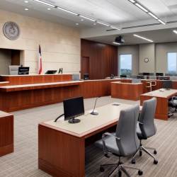 Individual desk-top mounted speakers are at all key positions in the courtrooms including witness, judge and counsel positions, and an overhead distributed speaker system provides audio support to the jury and audience areas of the courtroom.